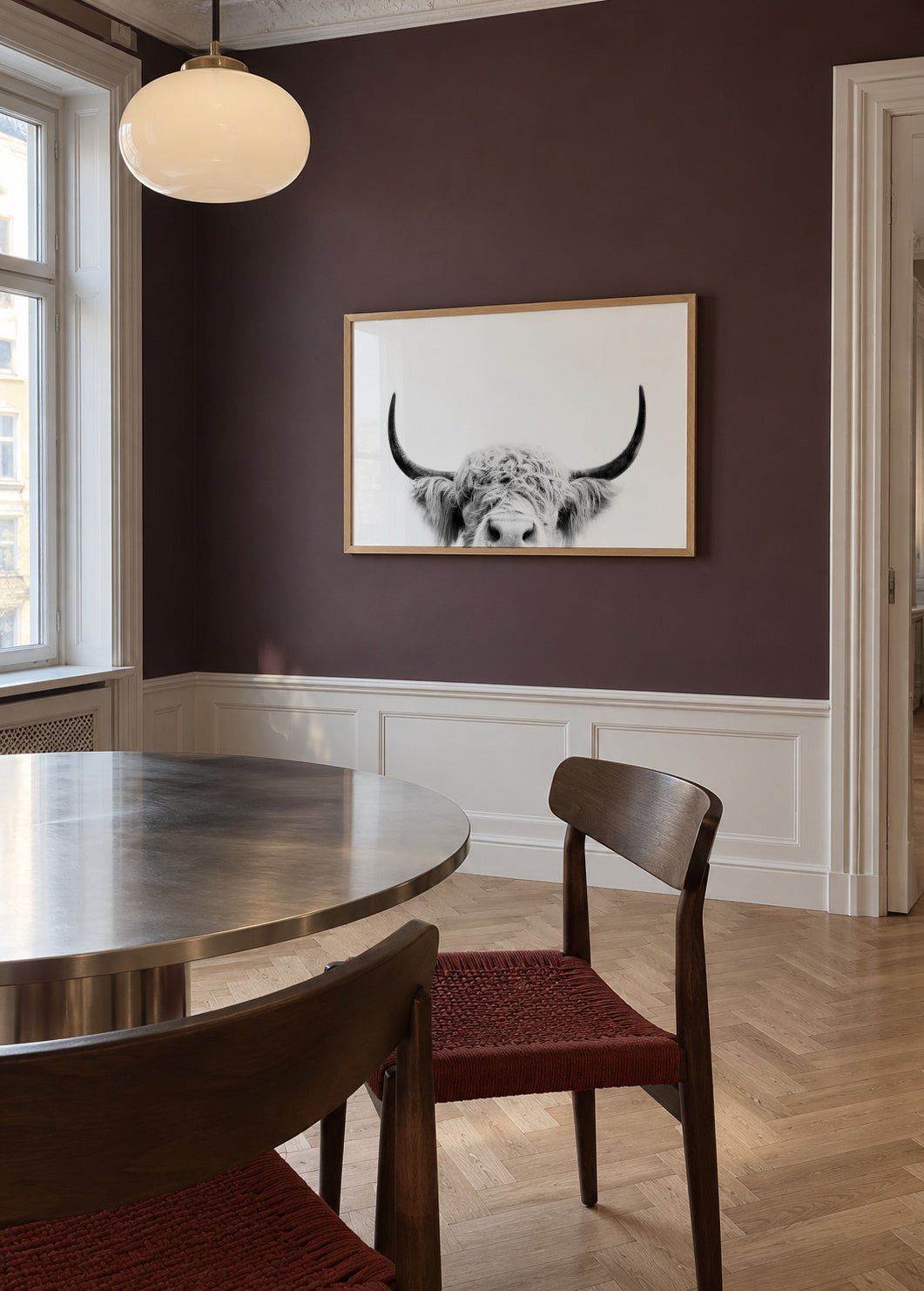 Peeking cow BW - Framed poster in an interior