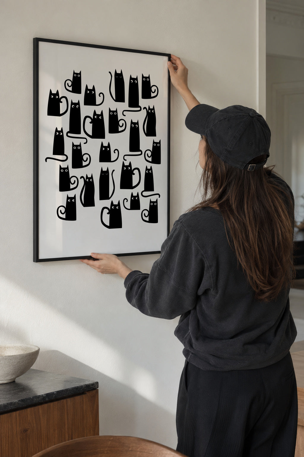 Black Cats - Framed poster in an interior