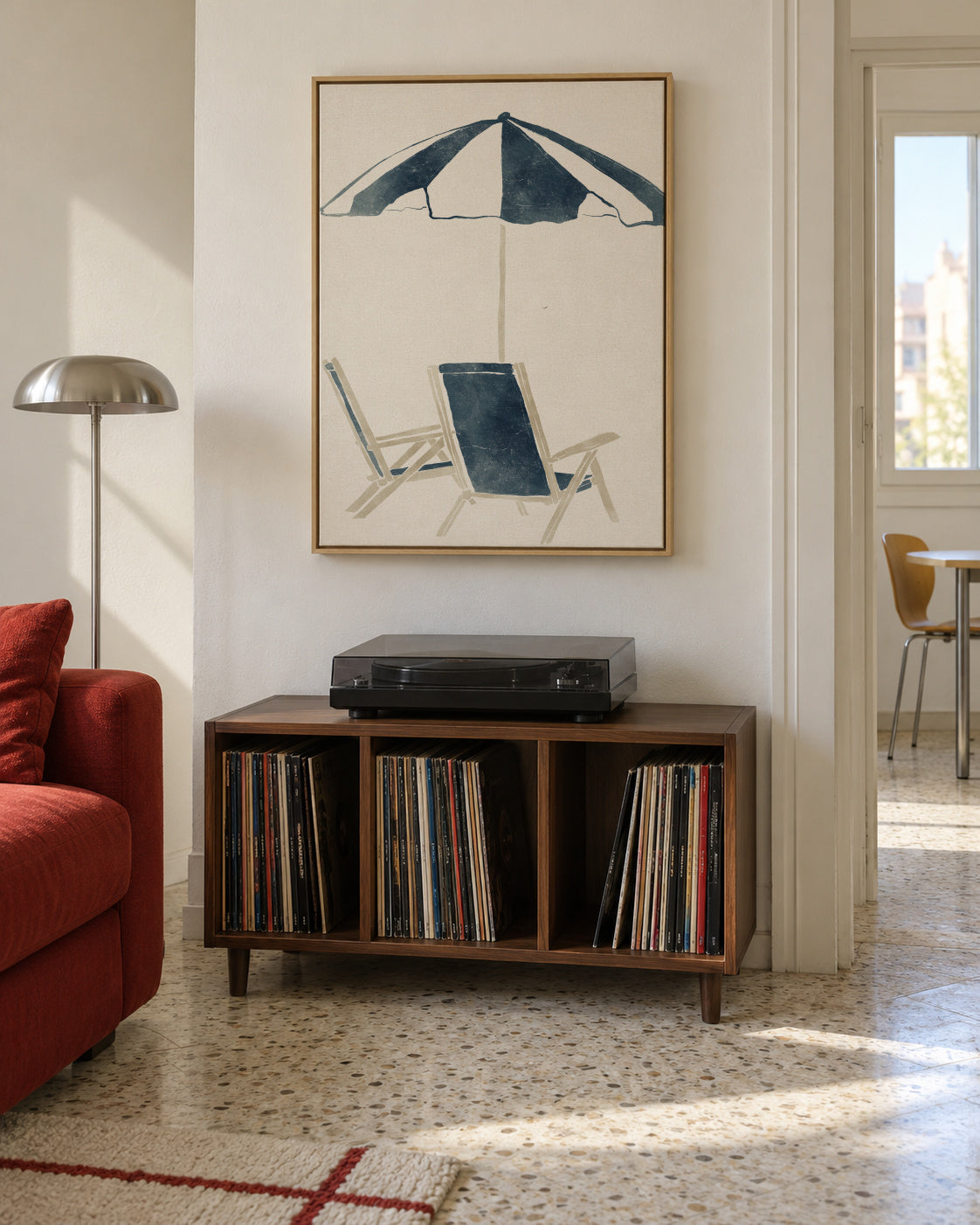 Blue Umbrella and Chairs - Framed canvas in an interior